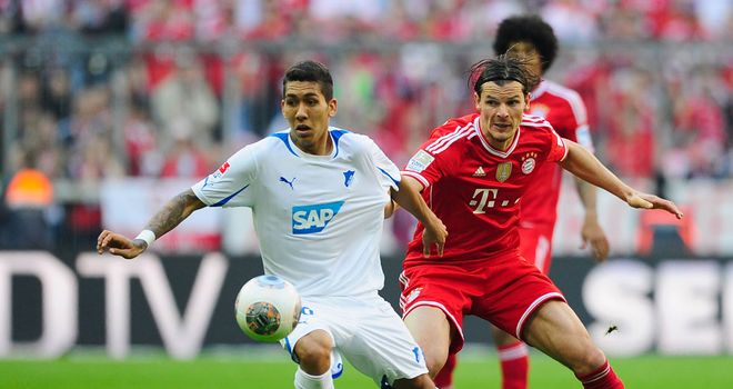 Roberto Firmino holds off Daniel van Buyten