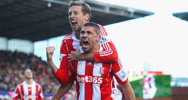Jon Walters and Peter Crouch celebrate the winning goal