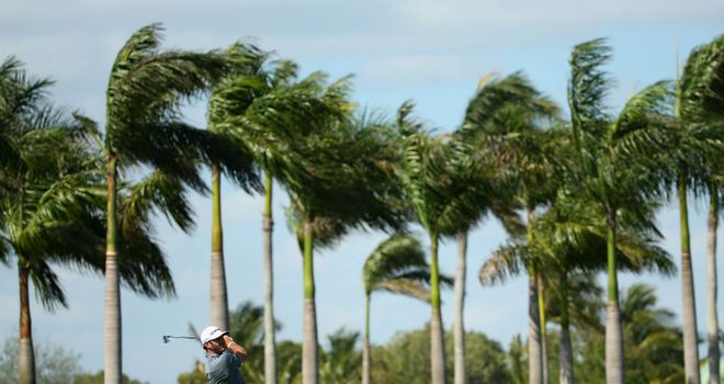 Dustin Johnson: American has a share of the lead after strong winds hit Doral on day two