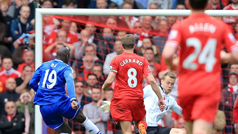 Steven Gerrard looks on as Chelsea's Demba Ba punishes his error