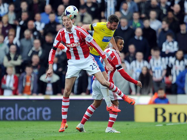 Crouch beats Dummett to a header