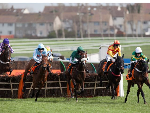 Cockney Sparrow (left) is about to swoop to win the Scottish Champion Hurdle