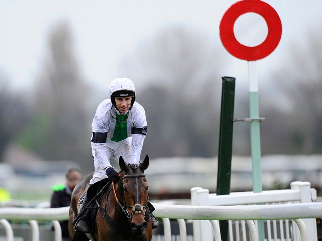 Leighton Aspell breaks out into a smile as Pineau De Re wins the Grand National
