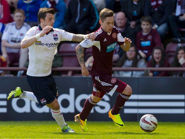 Sam Nicholson is closed down by Graham Carey