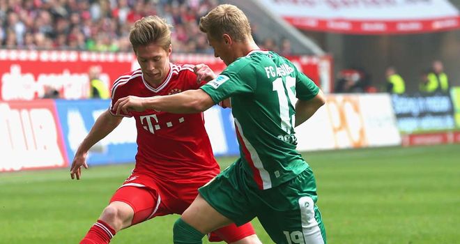 Mitchell Weiser battles for the ball with Matthias Ostrzolek