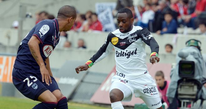 Ferreira Mariano vies for the ball with Ladislas Douniama