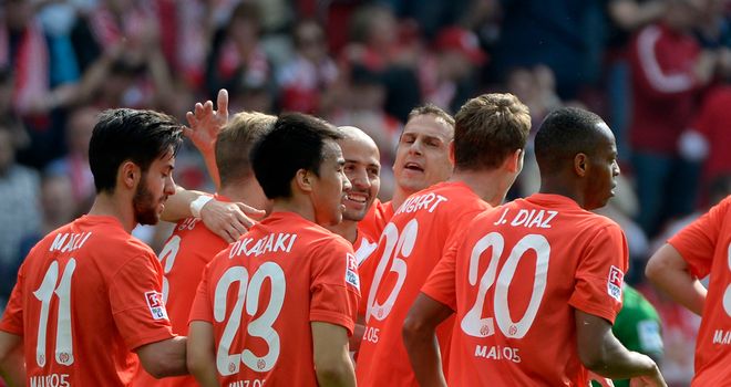 Mainz celebrate after an early own goal from Nils Petersen
