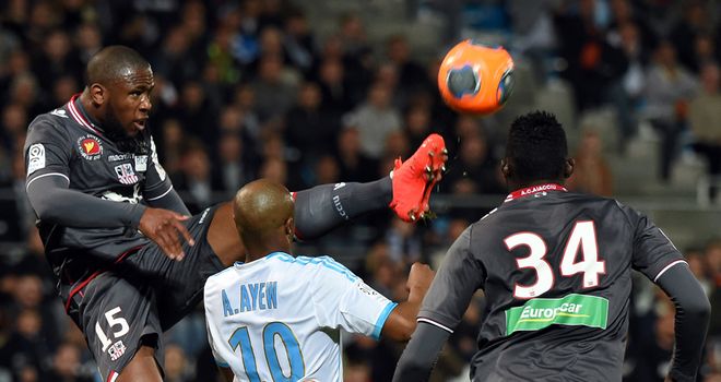Claude Dielna gets to the ball