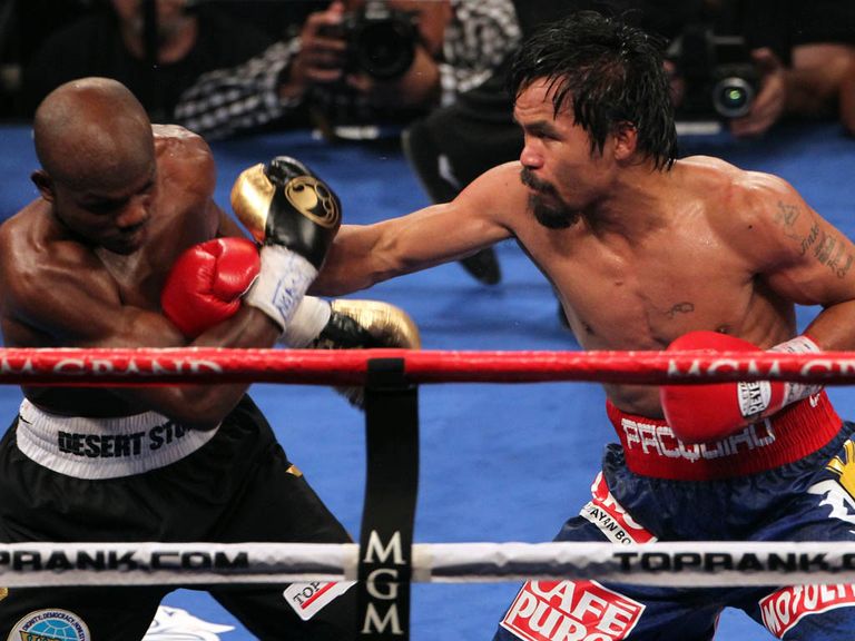 Pacquiao lands on Bradley in their first meeting