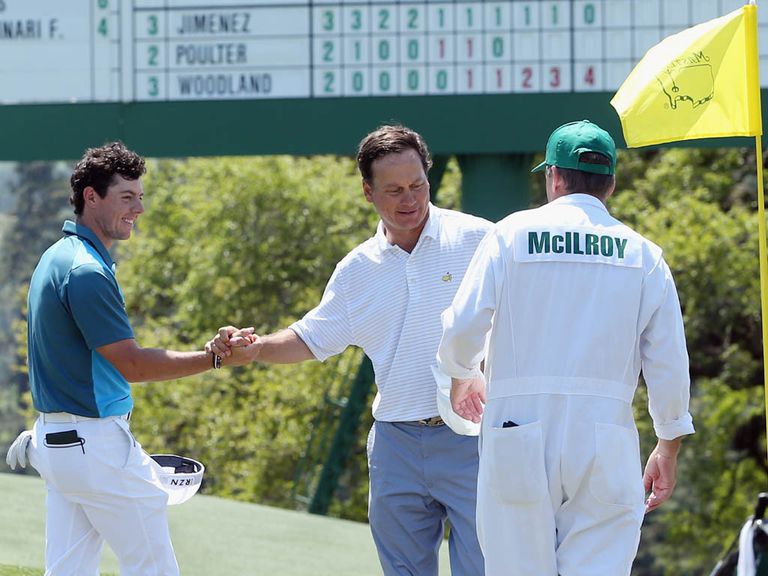 Rory McIlroy (l) shakes hands with marker Jeff Knox