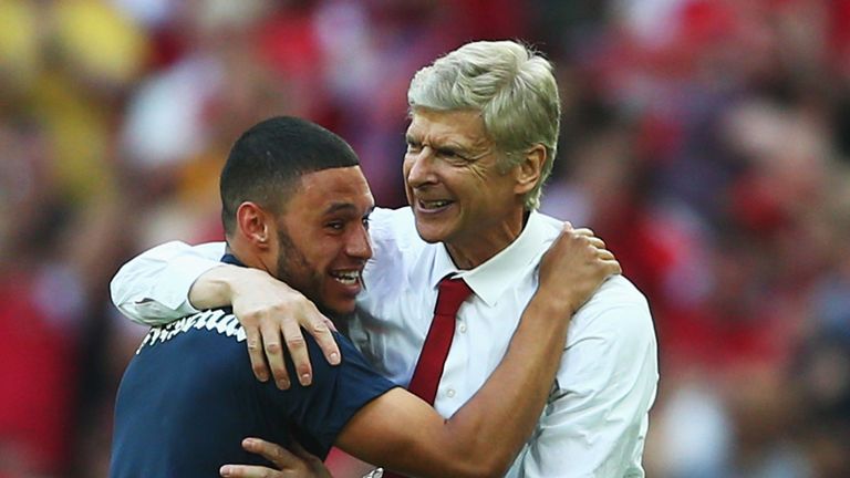 Arsene Wenger embraces Alex Oxlade-Chamberlain after ending Arsenal's long trophy drought