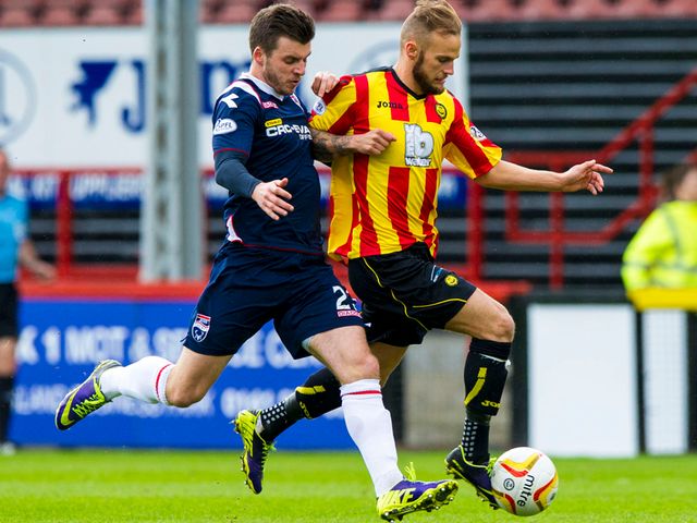 Kallum Higginbotham races ahead of Graham Carey