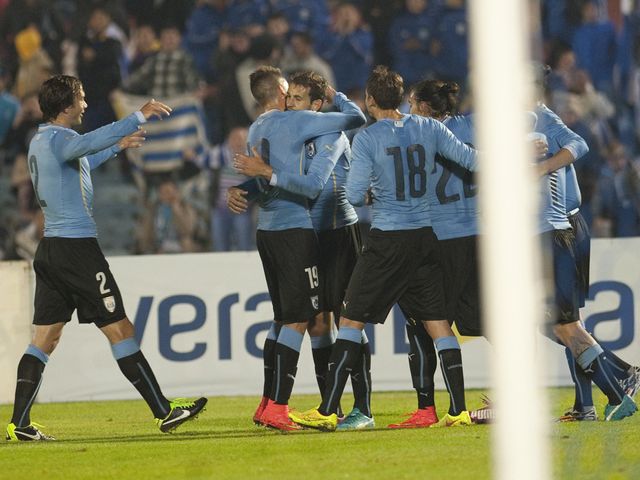 Uruguay's playes celebrate against Northern Ireland