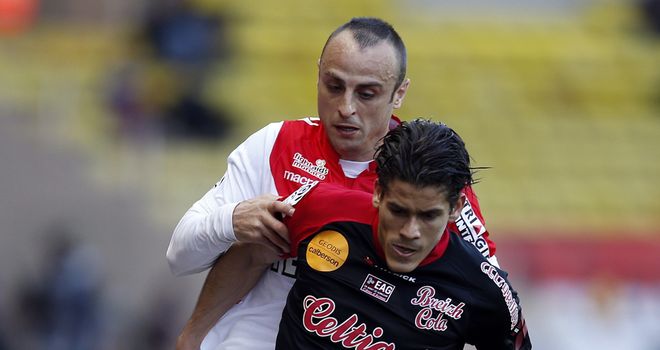 Monaco's Dimitar Berbatov challenges Dorian Leveque