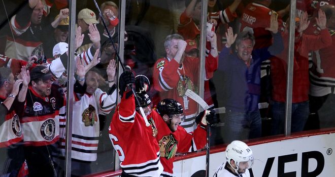 Michal Handzus and Patrick Kane celebrate beating the LA Kings