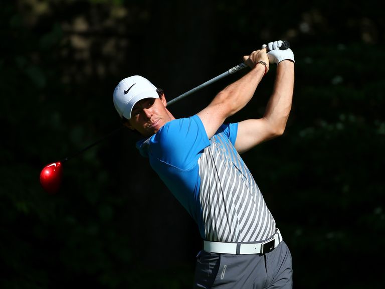 Rory McIlroy hits a tee shot on the 13th hole.