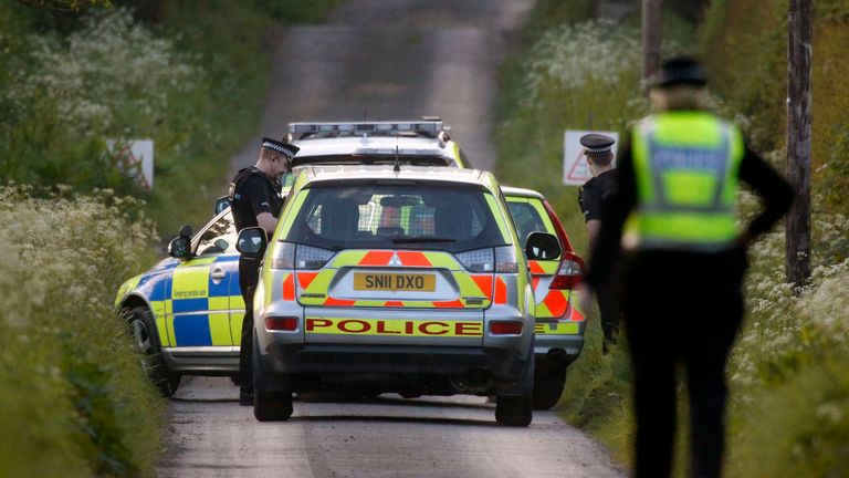 Police investigate the scene at Coldstream where two people after thought to have died