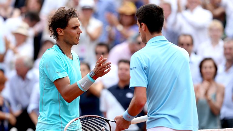 Nadal and Djokovic shake hands at the net