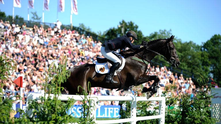 Tina Fletcher tackles the white rails on her way to winning in 2011