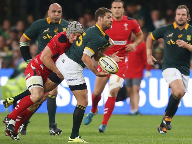 Jonathan Davies with a tackle on Willie le Roux