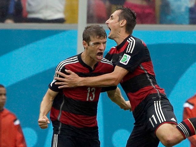 Germany's Thomas Muller celebrates with his teammate Miroslav Klose