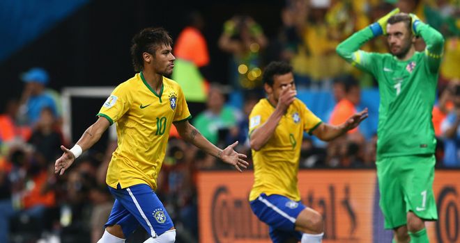 Neymar celebrates after scoring from the spot