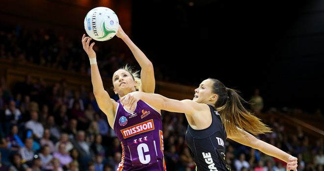Kimberley Ravaillion of the Firebirds and Courtney Tairi of the Magic compete for the ball during the ANZ Championship Prelim Final