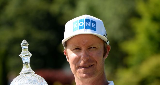Mikko Ilonen celebrates with the trophy