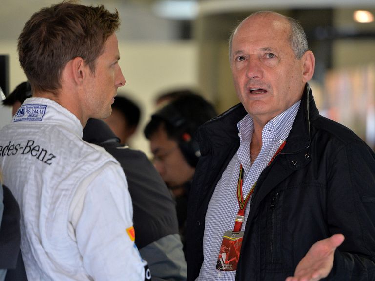 Dennis (r) says he wants Button to 'try harder'.
