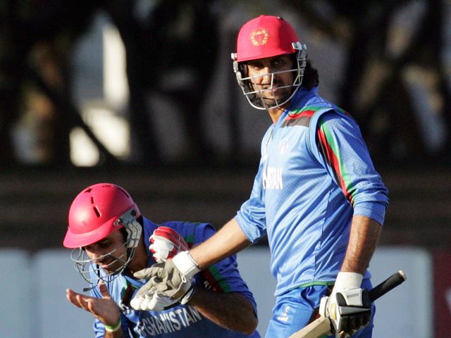 Afghanistan's Dawlat Zadran (l) and Shapoor Zadran celebrate
