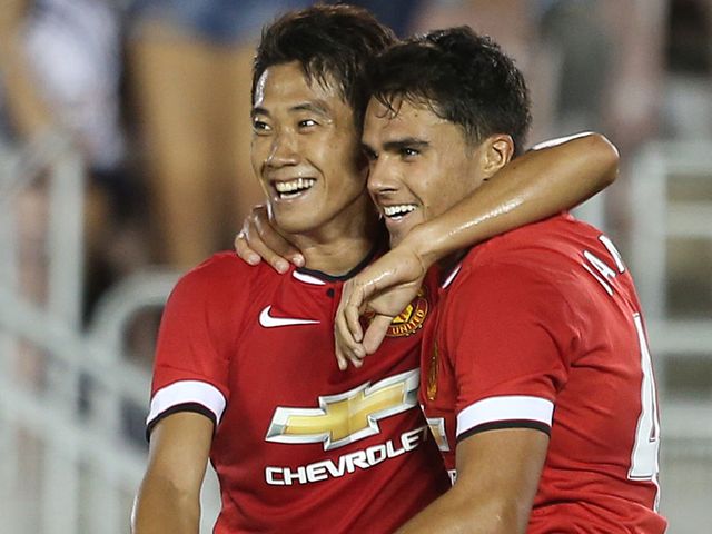 Shinji Kagawa (l) celebrates with Reece James