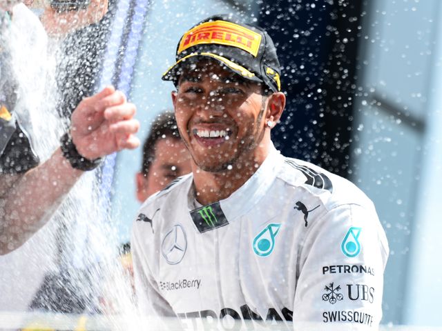 Race winner Lewis Hamilton celebrates