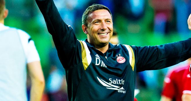 Derek McInness: Aberdeen boss celebrates his team's win in Groningen