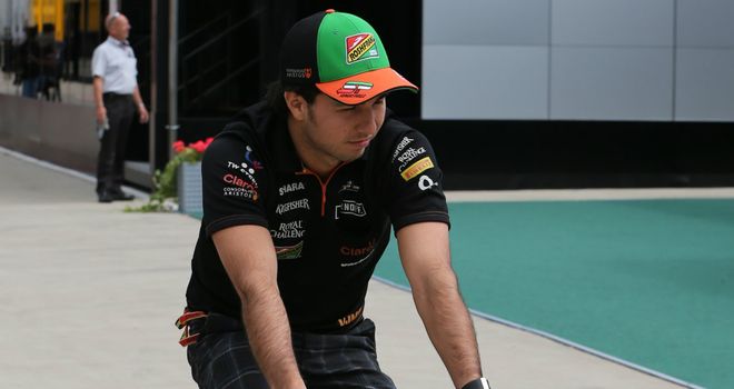Sergio Perez gets on his bike at Silverstone
