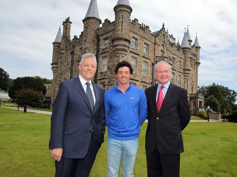 McIlroy poses with Robinson (l) and McGuinness (r) at Stormont - but without his trophy
