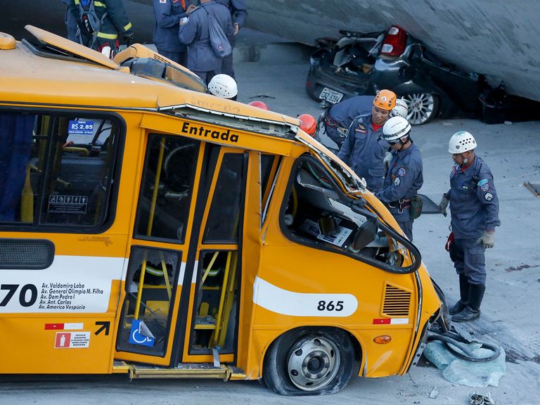 A bus was retrieved from underneath a collapsed bridge
