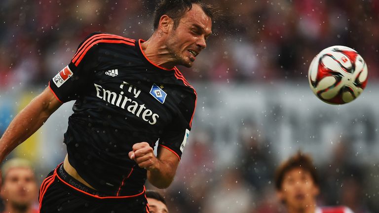 Hamburg striker Heiko Westermann heads for goal
