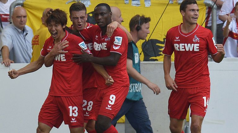 Cologne's Japanese forward Yuya Osako (l) celebrates his goal