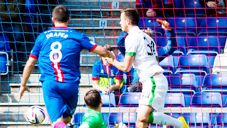 Inverness Caley score as the ball rebounds off young Celtic defender Eoghan O'Connell (r)