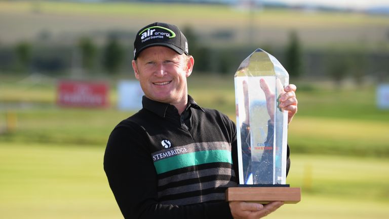 Jamie Donaldson poses with the trophy