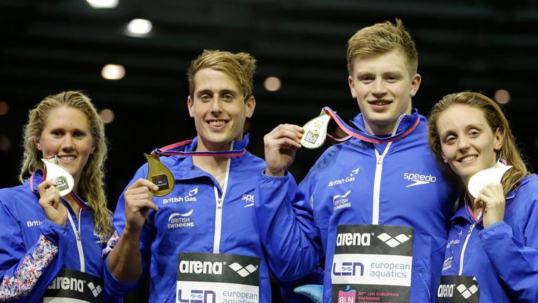 Britain's Jemma Lowe, Christoph Walker-Hebborn, Adam Peaty and Francesca Halsall, from left, show off their gold medals