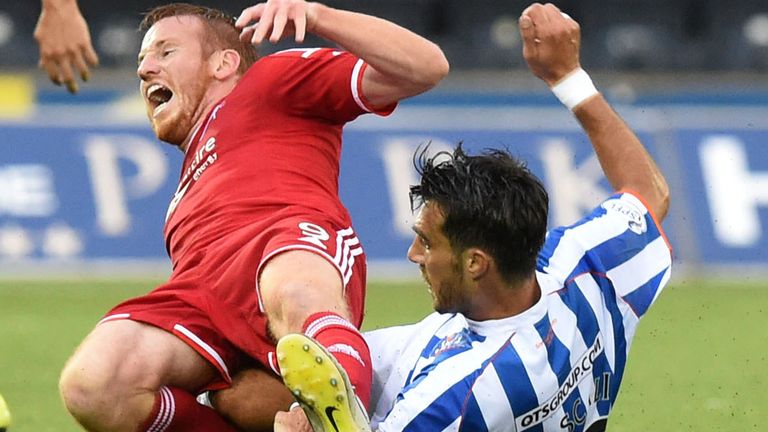 Manuel Pascali (r): Slides in on Adam Rooney at Rugby Park