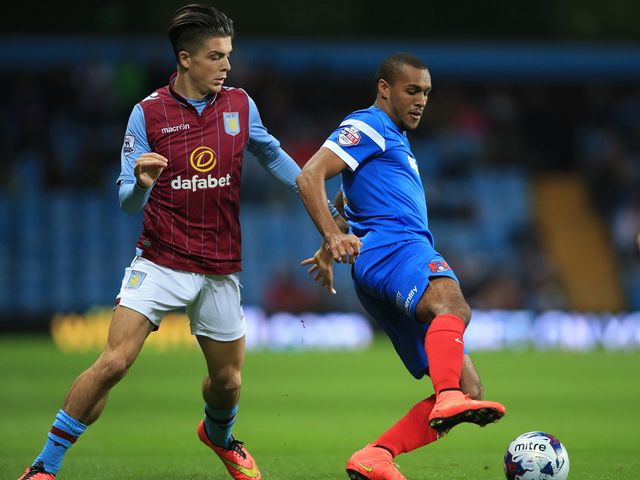 Aston Villa's Jack Grealish chases after Leyton Orient's Jay Simpson