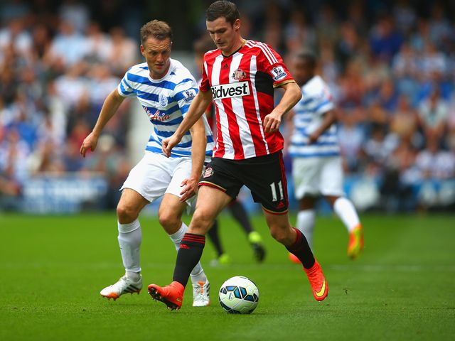 Clint Hill of QPR and Adam Johnson of Sunderland