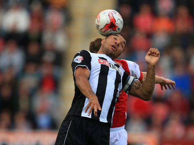 Watford's Troy Deeney and Rotherham's Richie Smallwood go for a high ball