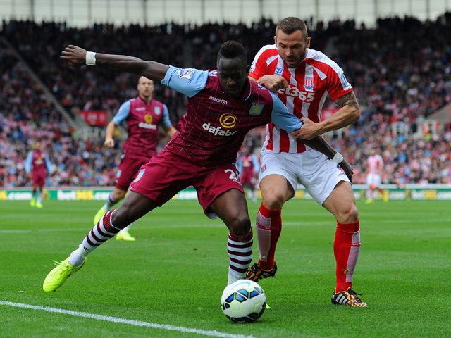 Aly Cissokho holds off Phil Bardsley of Stoke City