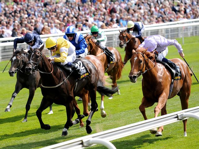 Dutch Connection ridden by William Buick (right) arrives late to nab Tocoolforschool ridden by Ben Curtis to win the Acomb Stakes.