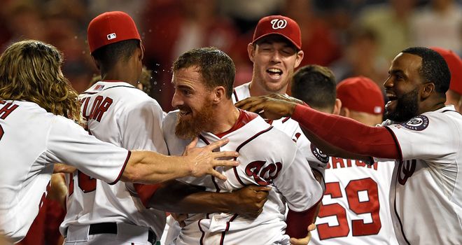 Adam LaRoche is mobbed by team-mates after his walk-off solo home run