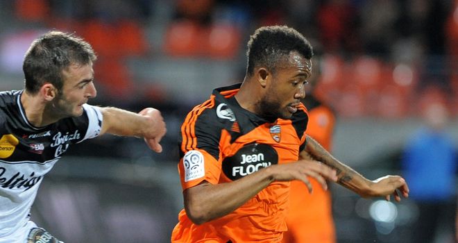 Lorient's forward Jordan Ayew vies with Guingamp's Reynald Lemaitre