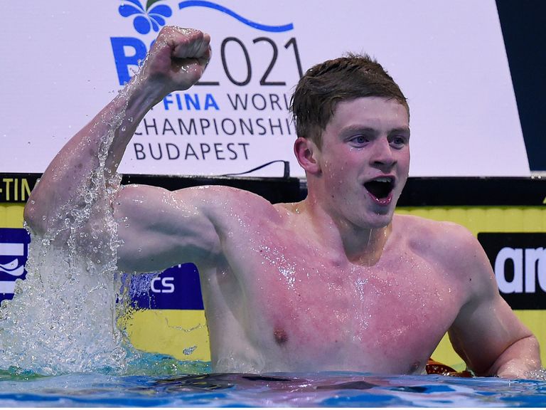 Adam Peaty celebrates his new world record